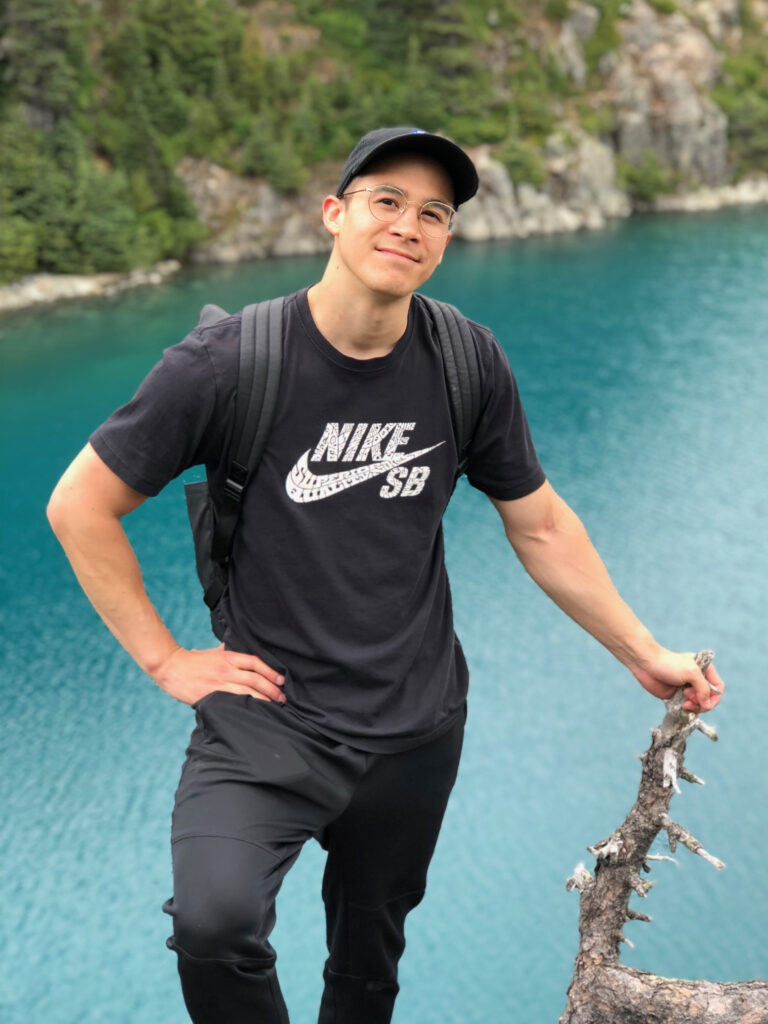 Portrait of Nolan Chow, Graphic Designer at WELL Health